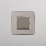 Retractive Single Rocker Switch in Polished Nickel White on White Background