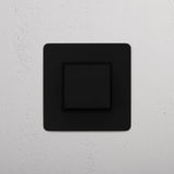 Smooth Operation Single Rocker Switch in Bronze Black on White Background