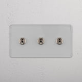 Functional Triple Toggle Switch in Clear Polished Nickel for Light Control on White Background