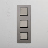 High Capacity Vertical Light Control Switch: Polished Nickel Black Triple 3x Vertical Rocker Switch on White Background